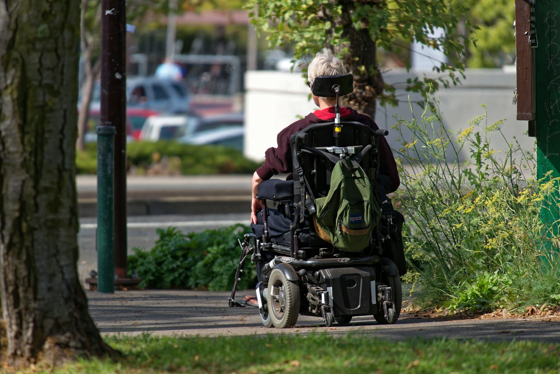 a disabled person using a motorised wheelchair